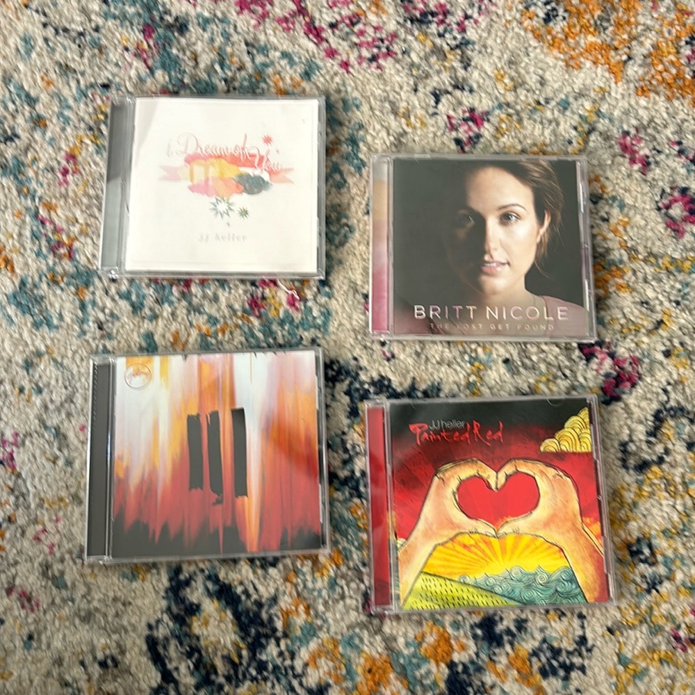 Jj Heller, Britt Nicole, and Hillsong CD disks